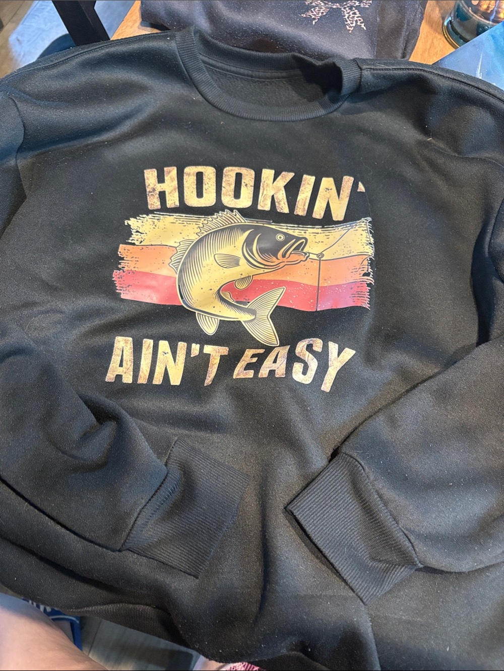 Black "Hookin' Ain't Easy" Fishing Sweatshirt